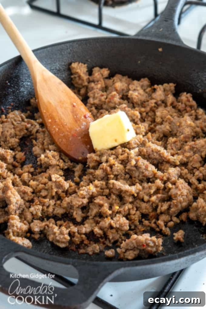 Hearty Country Gravy 4 Raw bulk pork sausage being browned in a cast iron skillet
