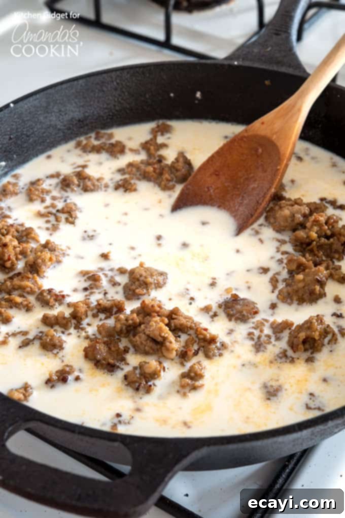 Hearty Country Gravy 6 Creamy sausage gravy simmering in a large cast iron skillet