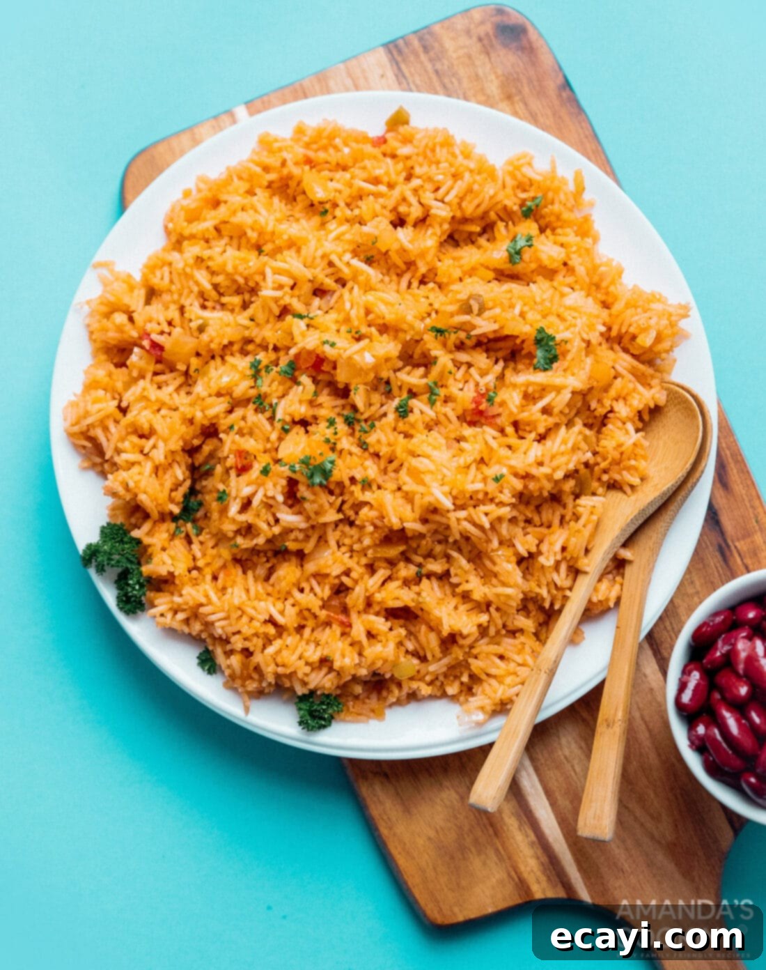 This spanish rice recipe is a classic for good reason. A flavorful combination of onion, garlic, and salsa makes a side dish everyone loves. #mexican #spanishrice #dinnersides #sidedishes #vegetarian  A serving of Classic Spanish Rice on a plate, highlighting its rich color and inviting texture, ready to be enjoyed.