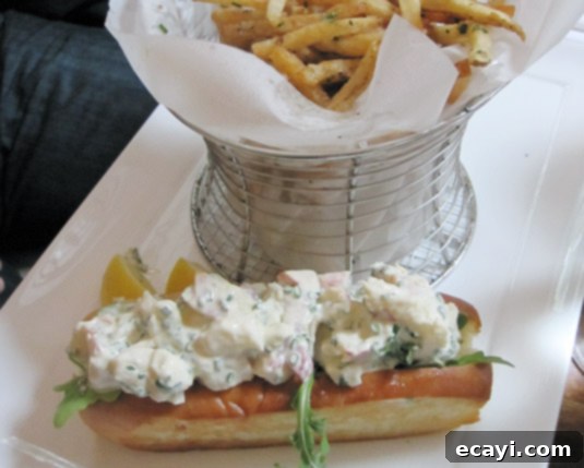 Dune's Classic Lobster Roll Dune's classic Chatham lobster roll with lemon chive aioli & garlic fries, Nantucket
