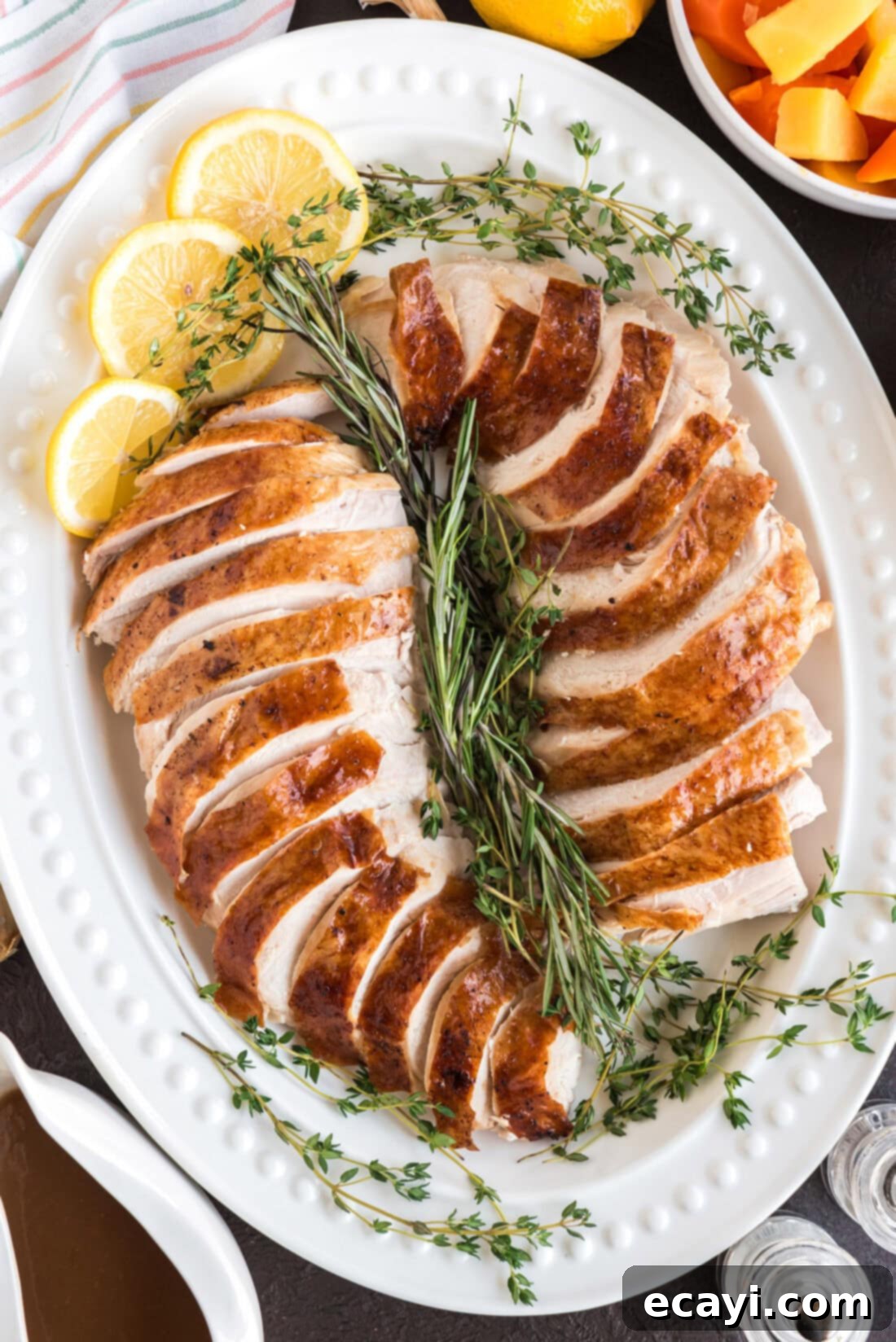Golden Glazed Turkey 3 Sliced Roasted Turkey on a white serving platter