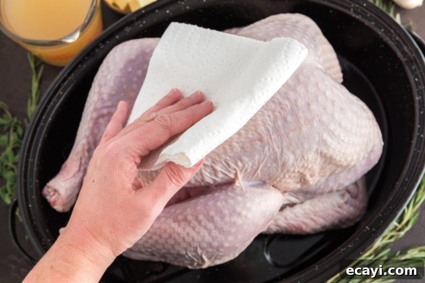 Golden Glazed Turkey 5 patting turkey dry with a paper towel
