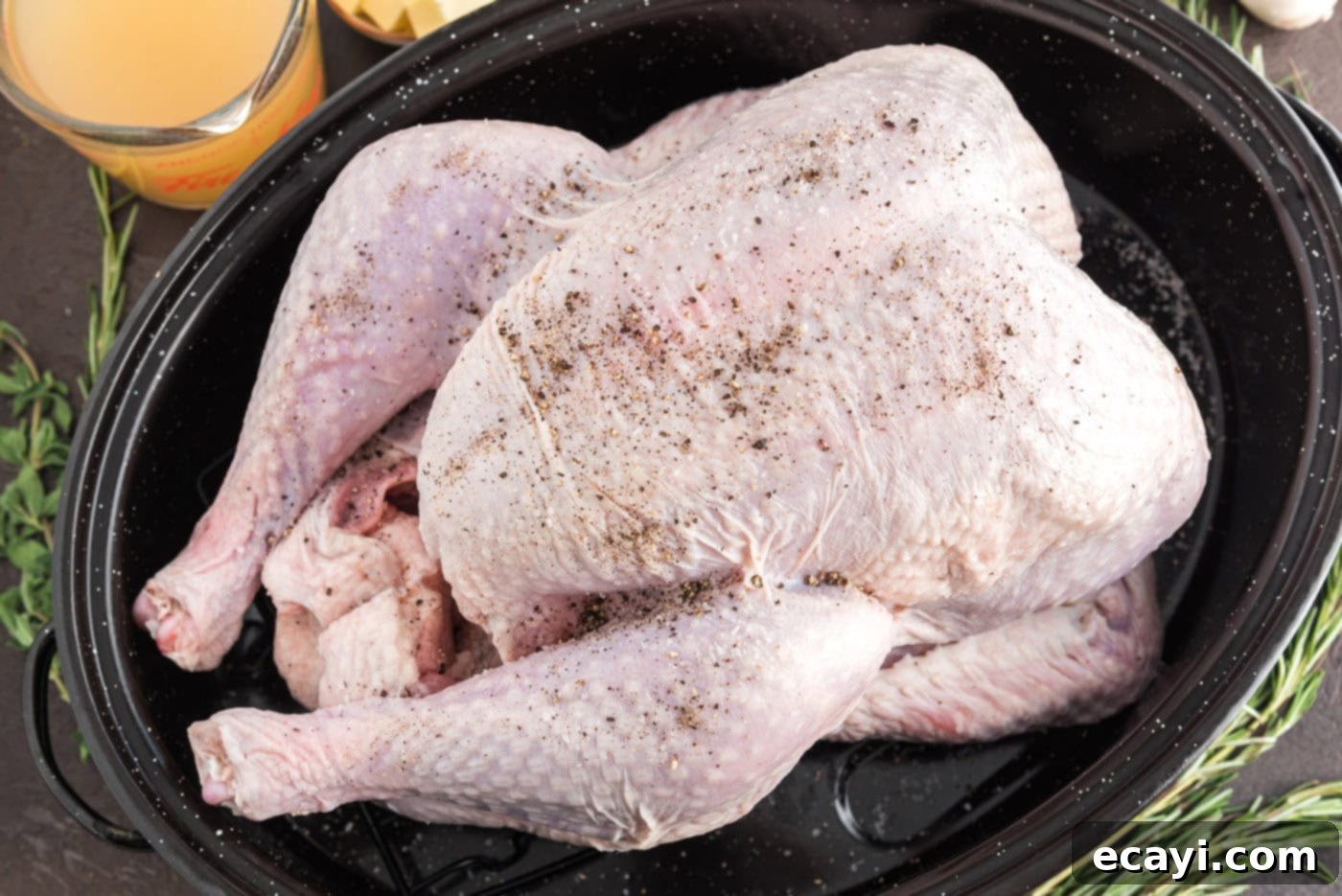 Golden Glazed Turkey 6 salt and pepper on top of raw turkey