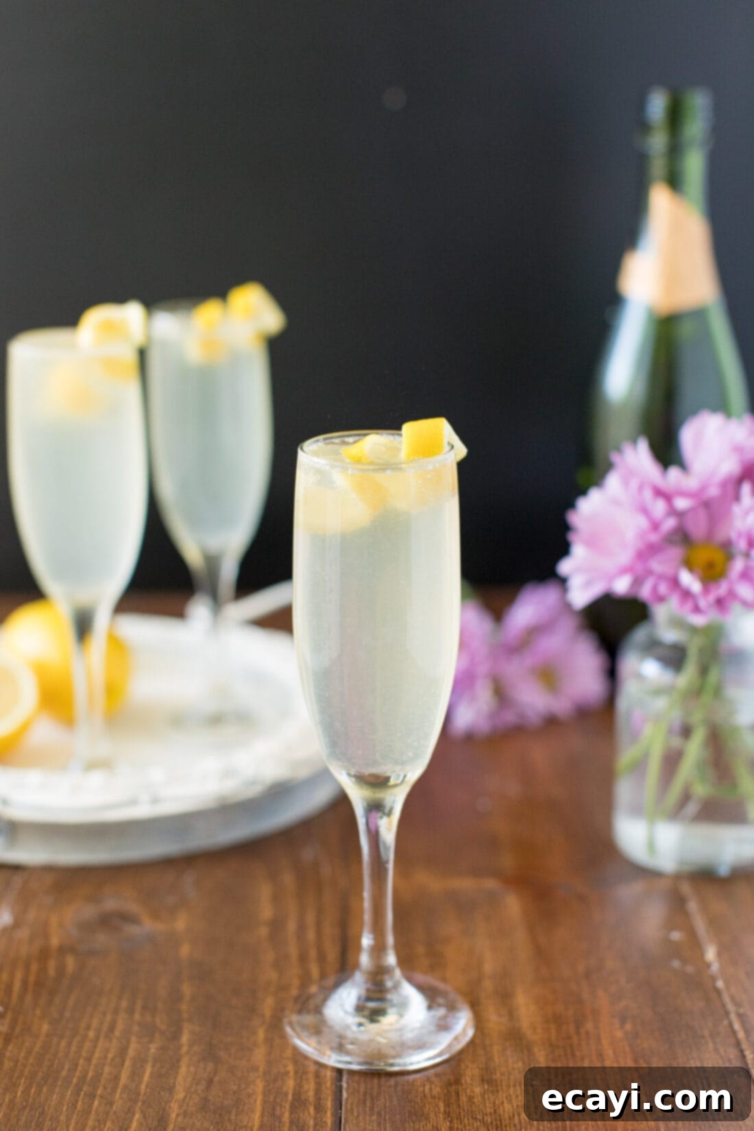 The Classic French 75: A Bubbly Gin and Champagne Cocktail Perfect for Brunch, Weddings, Holidays, and Summer Refreshment A perfectly prepared French 75 cocktail garnished with a fresh lemon twist, ready for enjoyment.