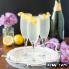 Effervescent Elan 4 Three French 75 cocktails garnished with lemon twists