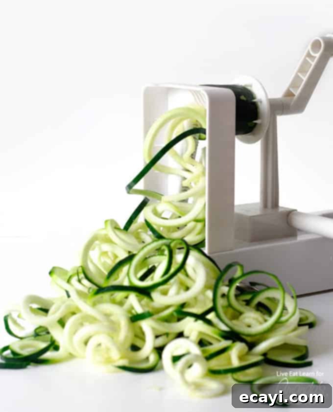 Zucchini noodles are a great low carb alternative to traditional pasta, and they’re so easy to make. Today we will show you how to make them at home! #zucchini #zucchininoodles #lowcarb #keto #lowcarbdinner #dinnerrecipes #vegetarian  spiraling zucchini noodles