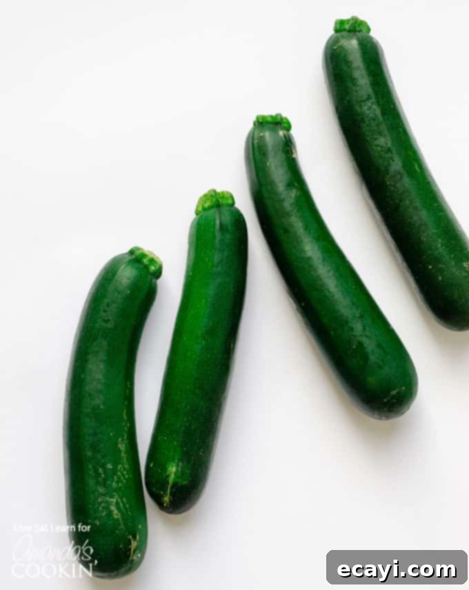 Zucchini noodles are a great low carb alternative to traditional pasta, and they’re so easy to make. Today we will show you how to make them at home! #zucchini #zucchininoodles #lowcarb #keto #lowcarbdinner #dinnerrecipes #vegetarian  fresh, whole zucchini