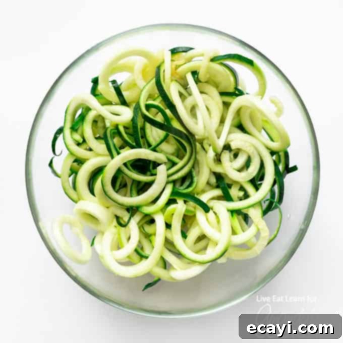 Zucchini noodles are a great low carb alternative to traditional pasta, and they’re so easy to make. Today we will show you how to make them at home! #zucchini #zucchininoodles #lowcarb #keto #lowcarbdinner #dinnerrecipes #vegetarian  A bowl of zucchini noodles