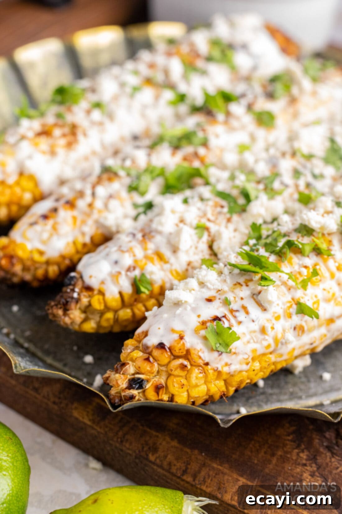 The ultimate summer side dish: Mexican Corn on the cob, bursting with flavor from cotija cheese, creamy mayo, and vibrant Latin spices. This easy and authentic recipe is a backyard BBQ essential! #streetcorn #elotesrecipe #spicycorn #lime mexican corn on the cob