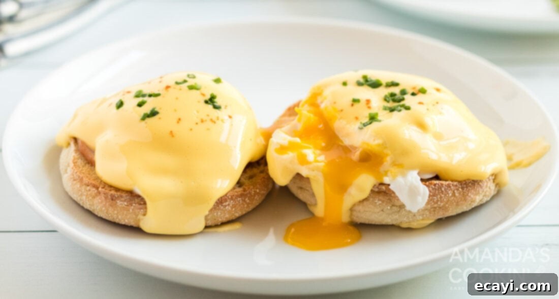 Eggs Benedict is a delicious open-faced English muffin sandwich. Topped with a perfectly poached egg, Canadian bacon, and a rich, creamy hollandaise sauce. #eggsbenedict #breakfast #breakfastrecipes #mothersdayrecipes #brunch #sandwich #breakfastsandwich #hollandaise eggs benedict