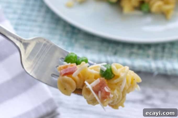 10 Irresistible Mac and Cheese Recipes 7 forkful of rotini and peas