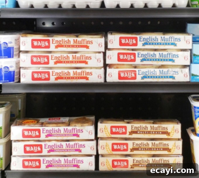 Muffin Pizza Creation Bar 4 Bays English Muffins packages displayed prominently in the dairy case of a grocery store, ready for purchase