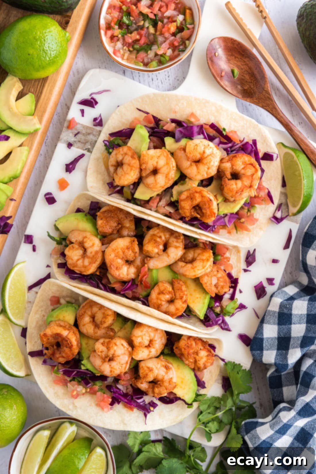 Zesty Shrimp Tacos 2 Three Shrimp Tacos surrounded by limes and pico