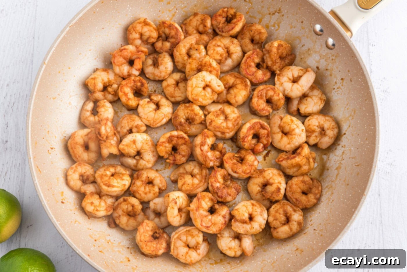 Zesty Shrimp Tacos 6 cooked seasoned shrimp in a skillet