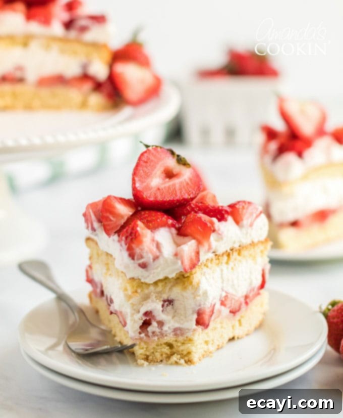 Delectable Strawberry Shortcake Slice A delectable slice of homemade strawberry shortcake cake on a plate, with a bite taken out, inviting you to taste its delicious layers.