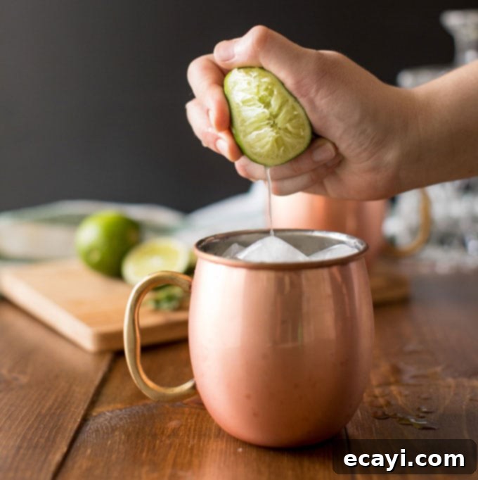 Copper Kick 4 squeezing fresh lime juice into copper mug