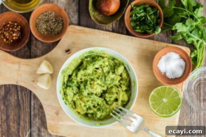 Avocado Toast 5 Fresh avocado mashed in a bowl with a fork, ready for seasoning and spreading.