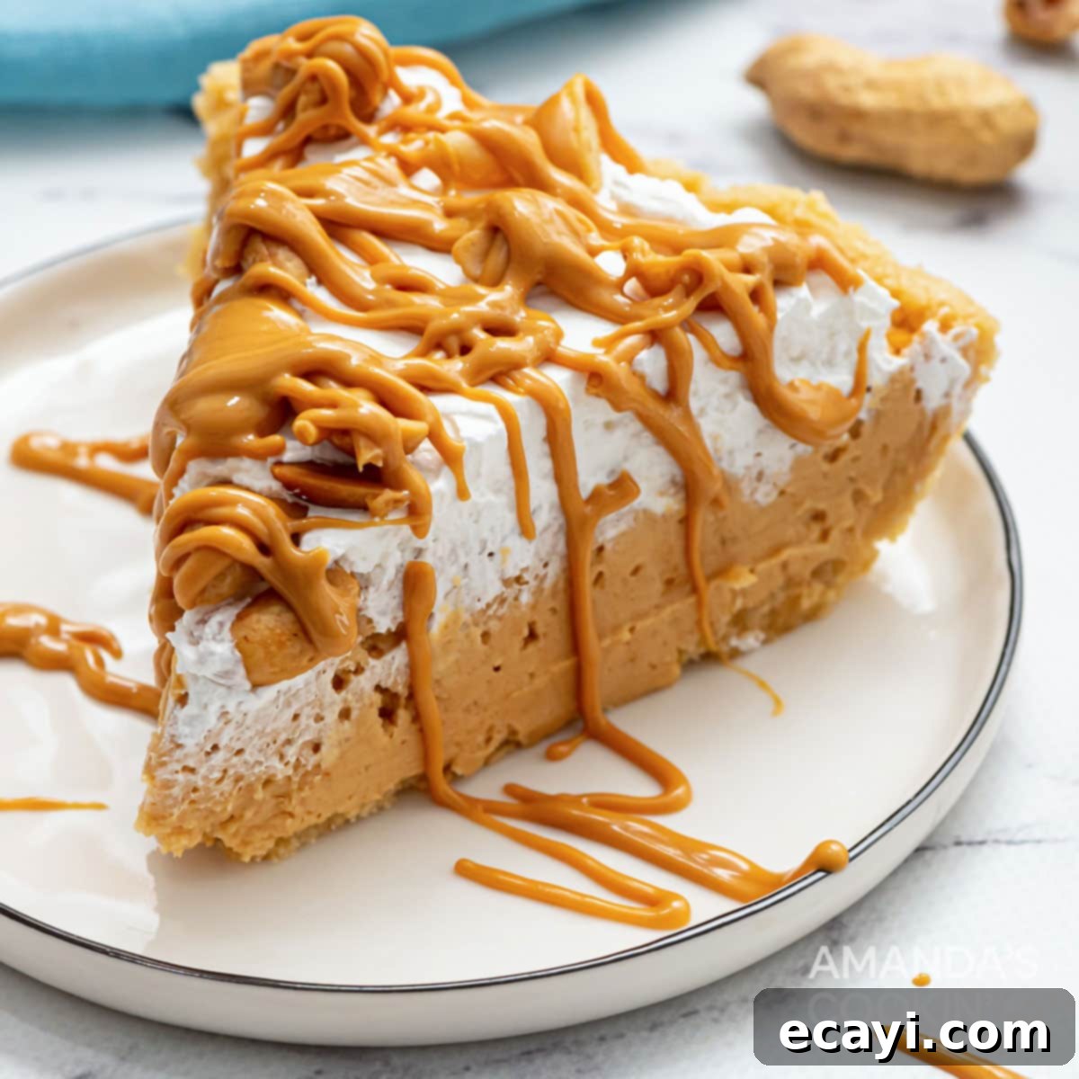 Effortless Peanut Butter Bliss 9 slice of whipped cream topped peanut butter pie