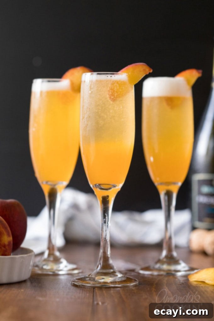Commonly called a peach bellini, this combination of peach puree and Prosecco is served in a champagne flute and garnished with a fresh peach wedge. bellini cocktails in champagne flutes