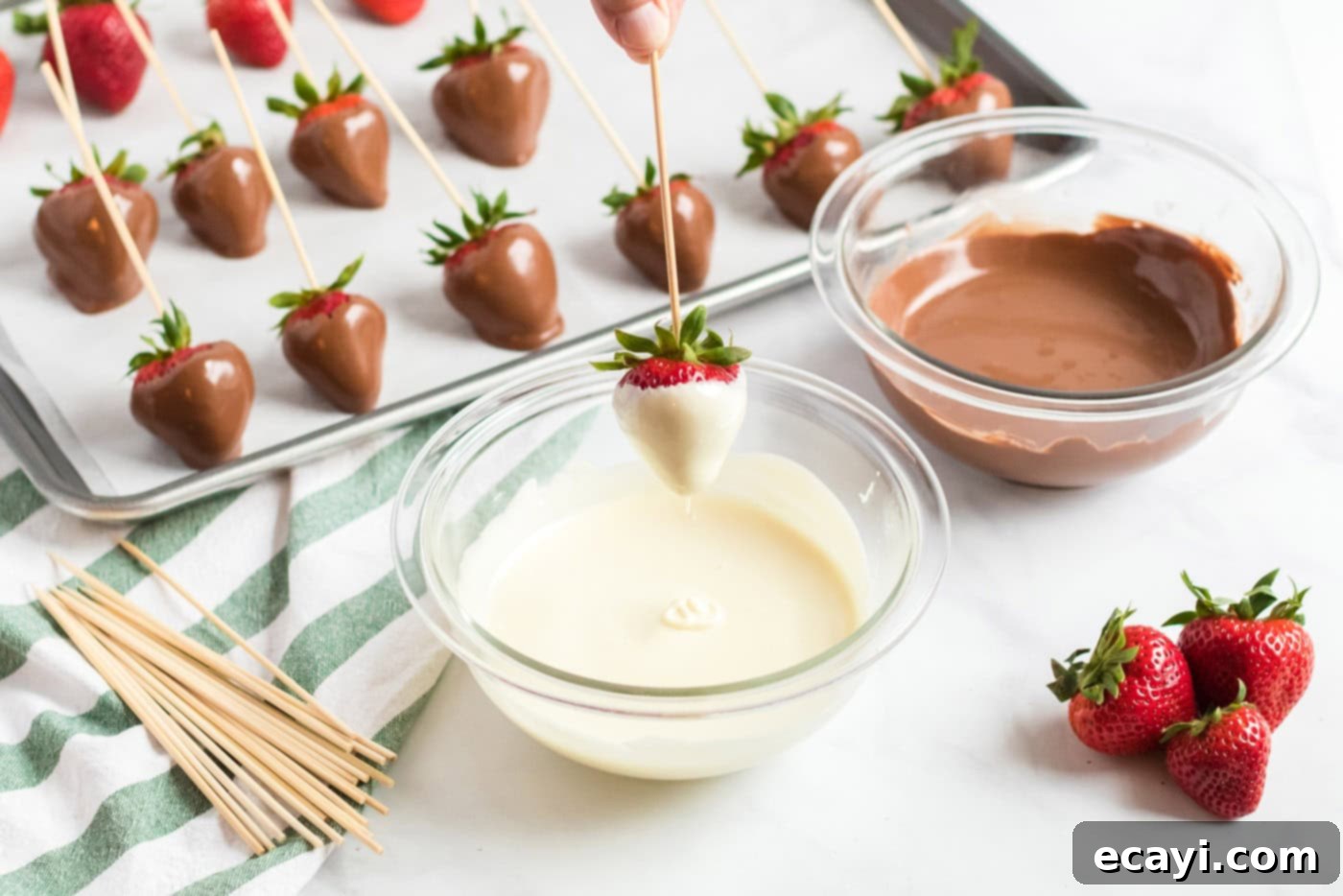 Indulgent Chocolate-Dipped Strawberries 6 dipping a strawberry into melted chocolate
