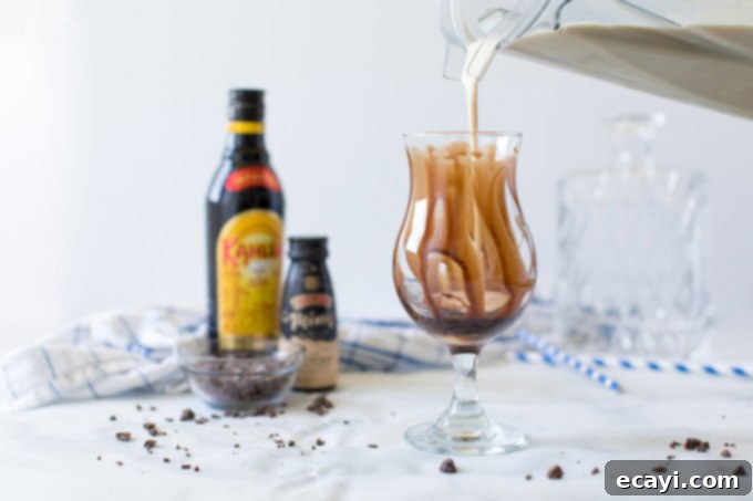 Decadent Chocolate Chill 4 pouring blender contents into chocolate covered glass
