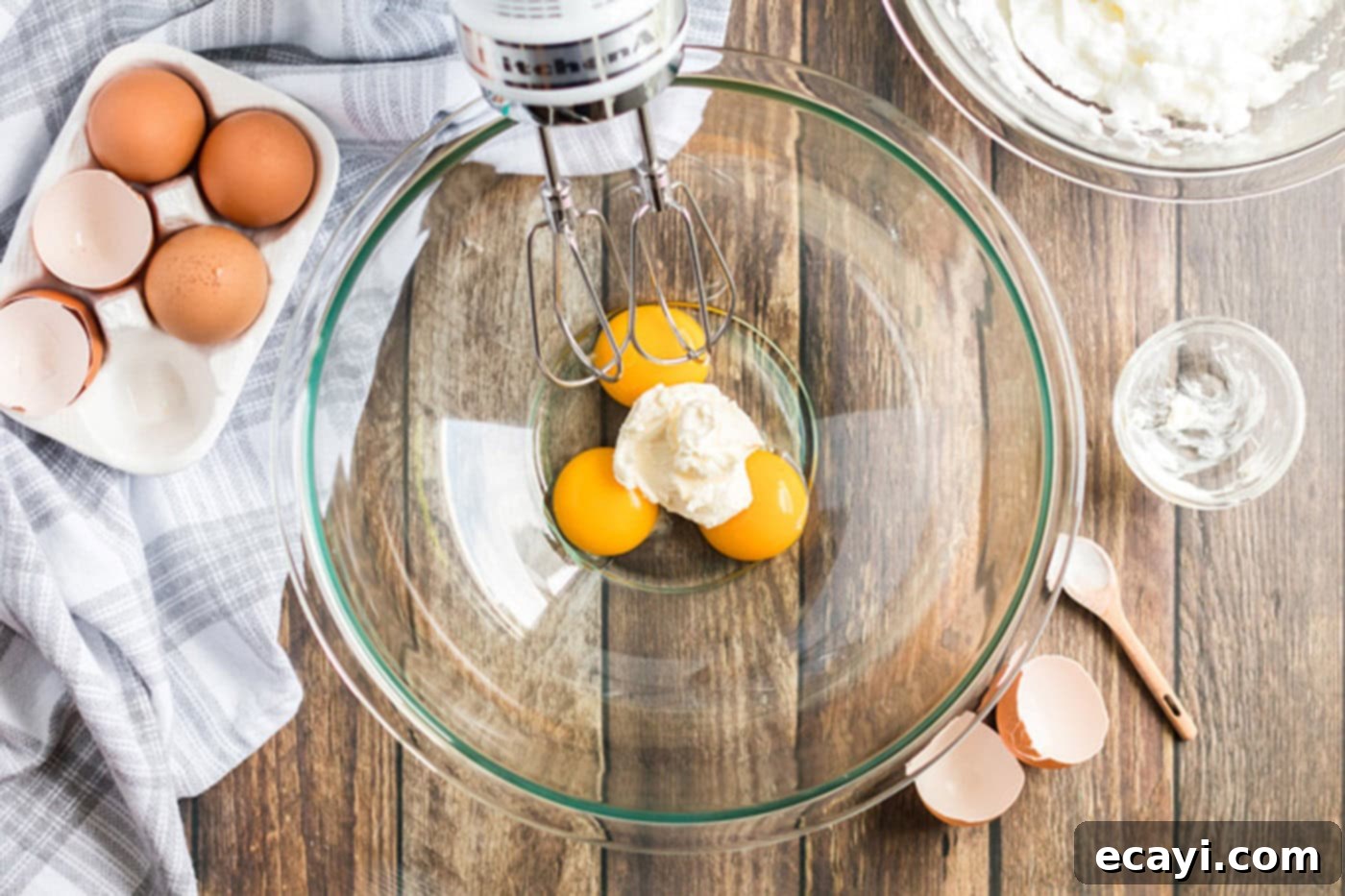 Airy Cloud Dream 6 Softened cream cheese and egg yolks in a bowl, ready to be mixed into a smooth blend