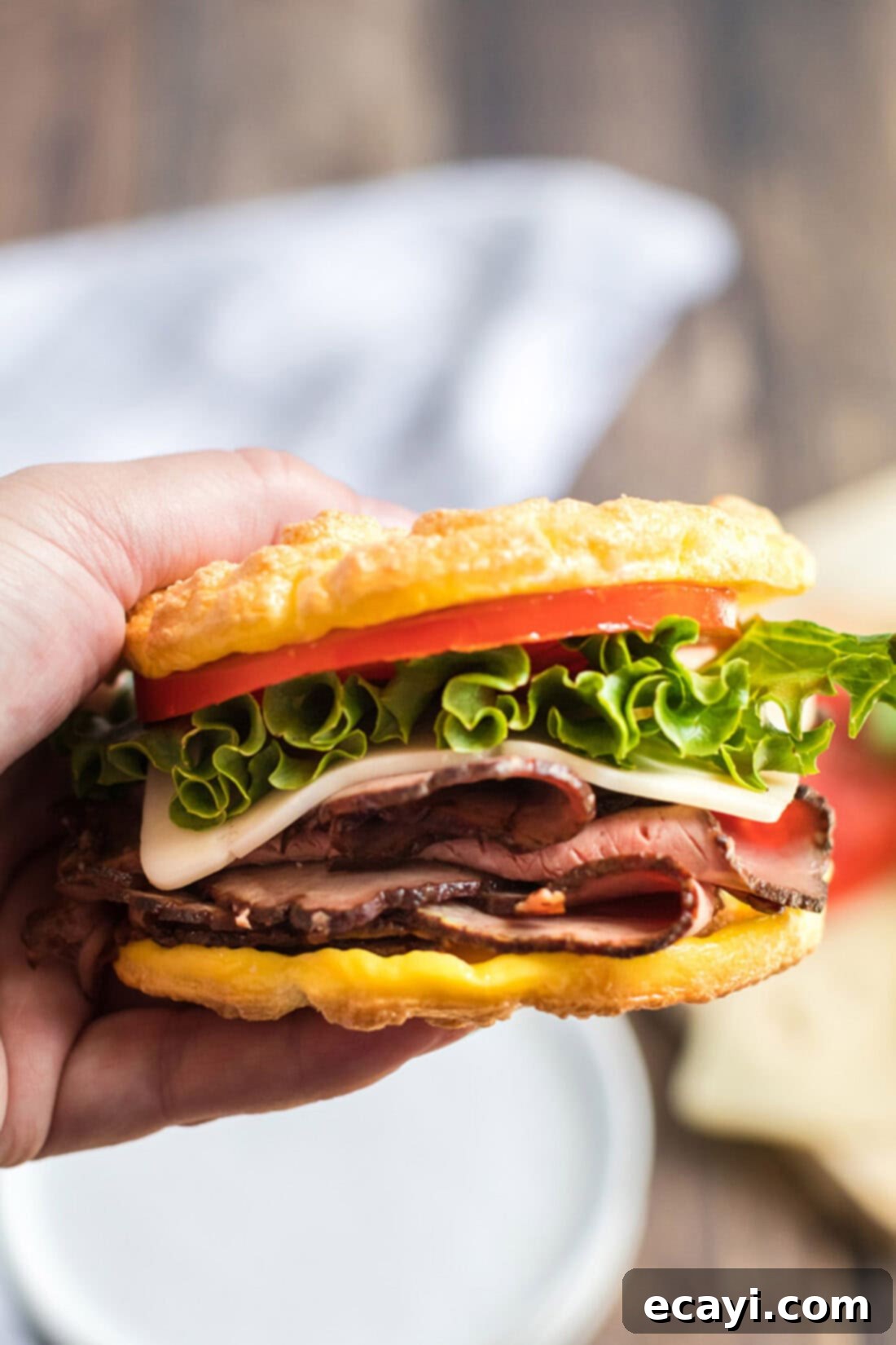 Airy Cloud Dream 10 Hand holding a delicious low-carb sandwich made with fluffy Cloud Bread