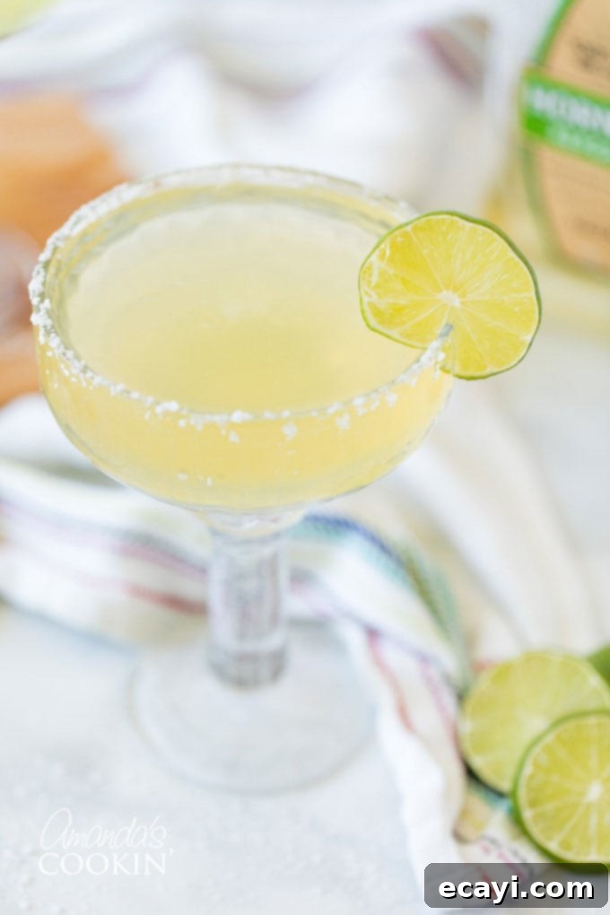 Learn how to make a margarita drink on the rocks. This classic cocktail is perfect any time of year, but especially fun for Cinco de Mayo and Margarita Day! #margarita #howtomakeamargarita #margaritadrink #margaritarecipe #margaritaontherocks #cincodemayo #cocktails #nationalmargaritaday #amandascookin margarita without ice