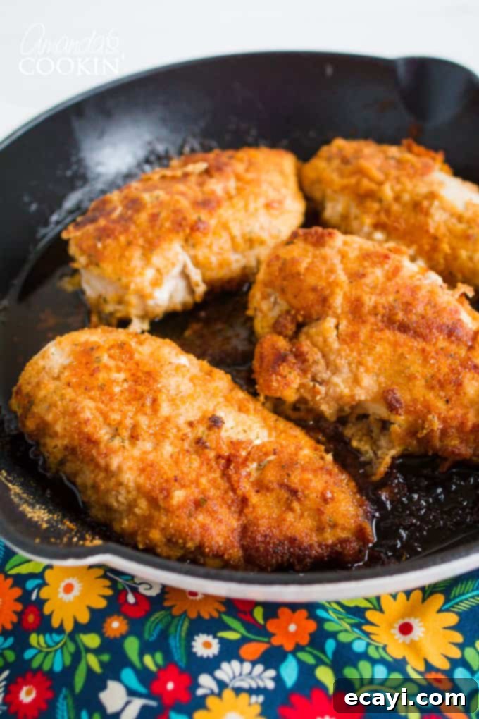 This spicy oven fried chicken gets its flavor from the spicy marinade. Be sure to marinate the chicken the suggested amount of time for perfect results! Spicy Oven Fried Chicken in skillet