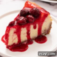 Decadent Cherry Cheesecake 11 slice of cherry cheesecake on a plate