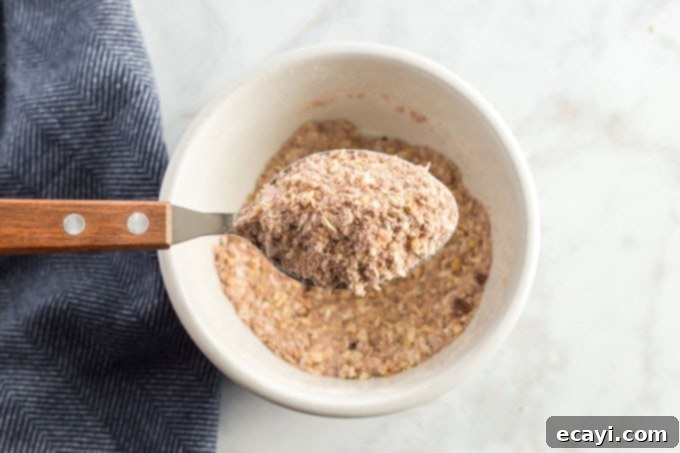 Classic Homemade Chili 5 Homemade chili seasoning mix in a spoon, showcasing the colorful spice blend