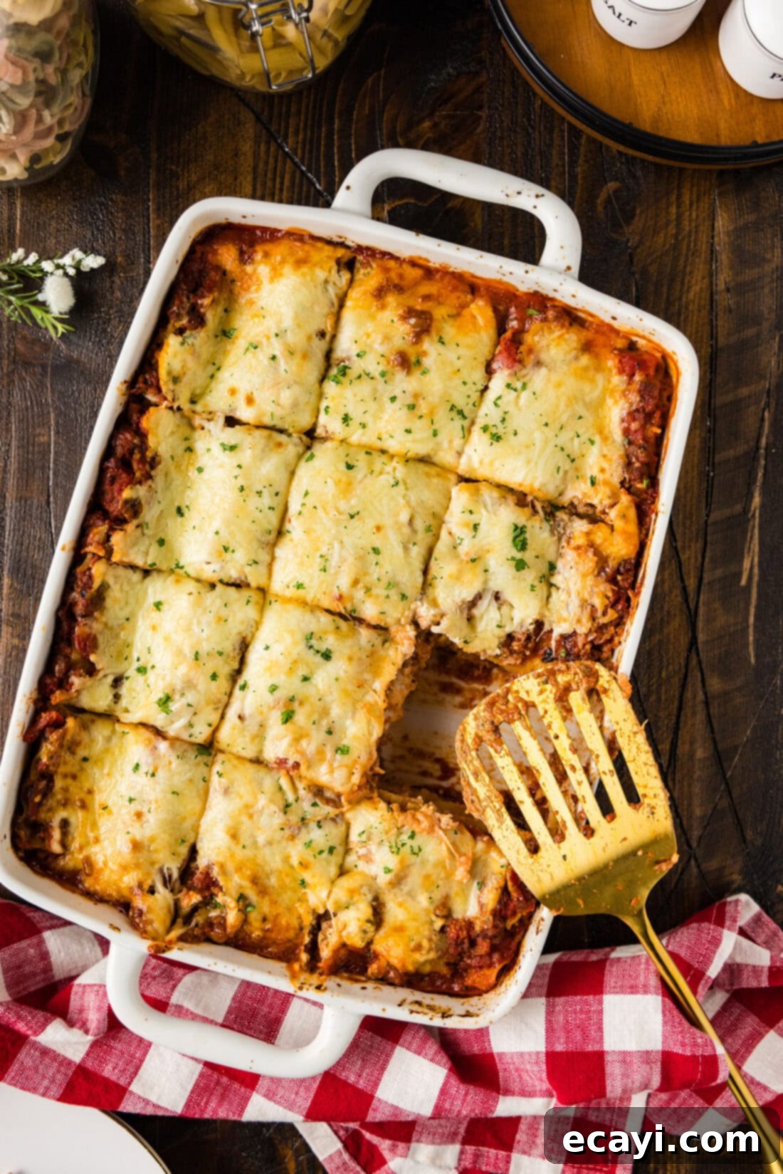 Classic Italian Lasagna 2 A pan of perfectly baked Italian Lasagna cut into generous squares, with one slice carefully removed, showcasing its delicious layers of meat, cheese, and noodles.