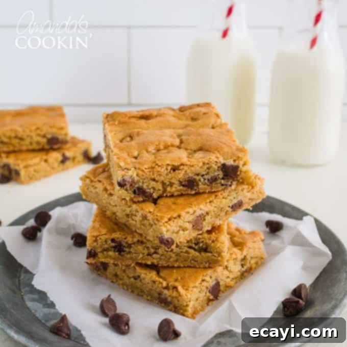 Golden Chocolate Chip Blondies 5 A beautiful stack of chewy chocolate chip blondies, ready for enjoyment.
