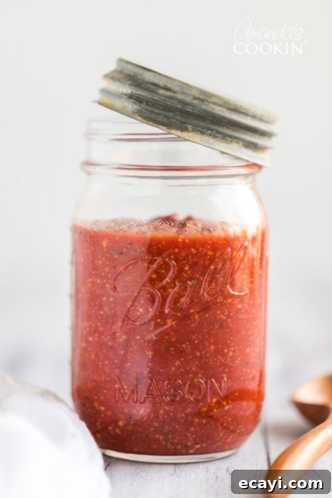How to make homemade pizza sauce. You likely have all the ingredients in your pantry! Learn how to make your own pizza sauce and freeze it for later too! homemade pizza sauce in a jar