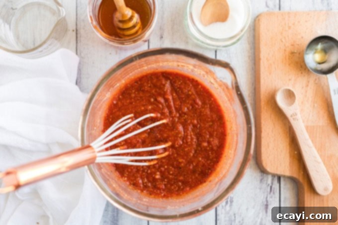 Pizza's Flavor Foundation 5 bowl of sauce with a whisk