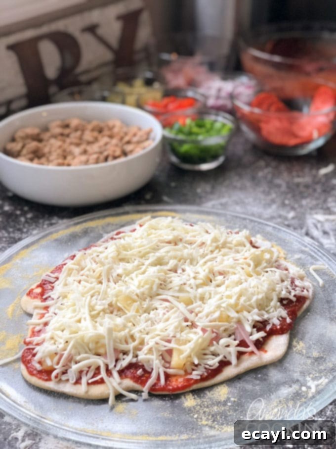 How to make homemade pizza sauce. You likely have all the ingredients in your pantry! Learn how to make your own pizza sauce and freeze it for later too! building a pizza