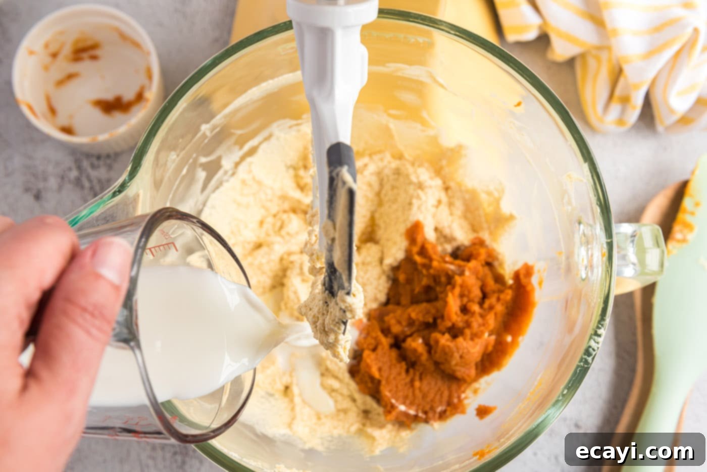 Spiced Pumpkin Chocolate Chip Muffins 12 Adding pumpkin puree and buttermilk to the butter mixture in a bowl for muffins