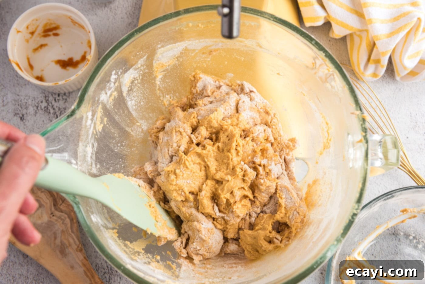 Spiced Pumpkin Chocolate Chip Muffins 13 Pumpkin muffin dough starting to form in a mixer bowl, showing the consistency