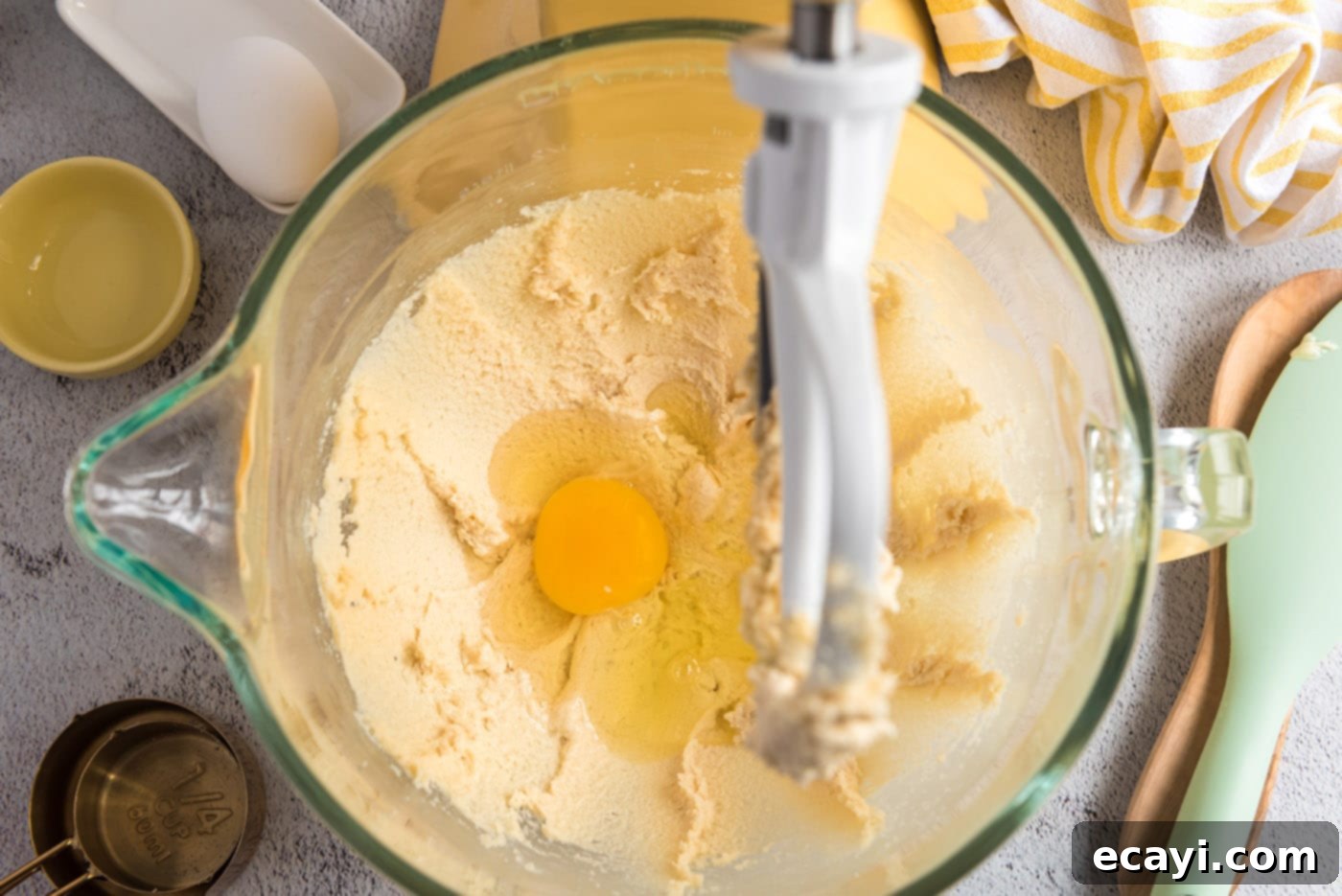 Spiced Pumpkin Chocolate Chip Muffins 10 Adding eggs one by one to the butter and sugar mixture for muffin batter