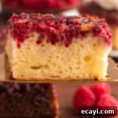 Ruby Raspberry Reveal 15 Raspberry Upside Down Cake on a spatula
