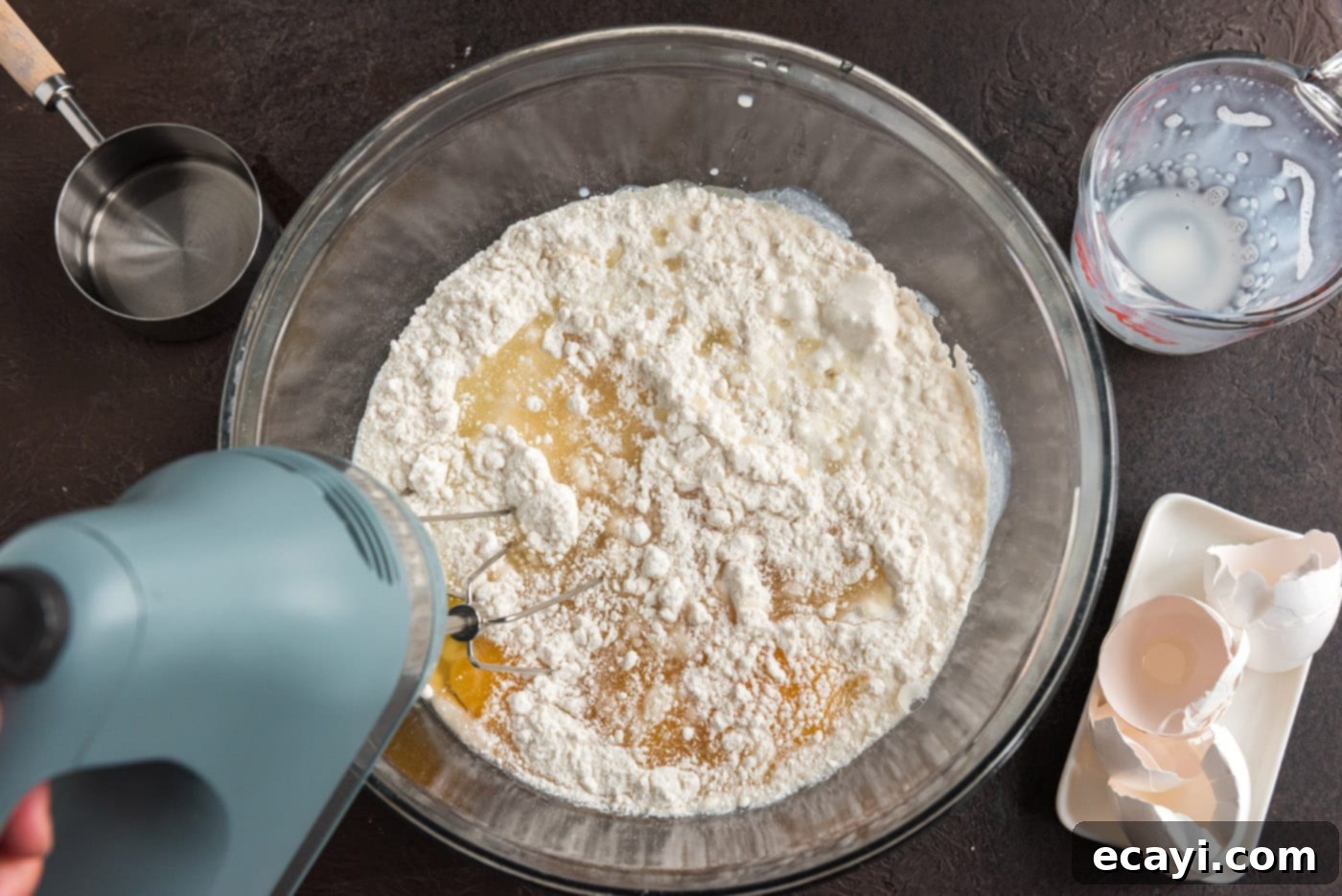 Ruby Raspberry Reveal 5 beating cake batter ingredients in a mixing bowl