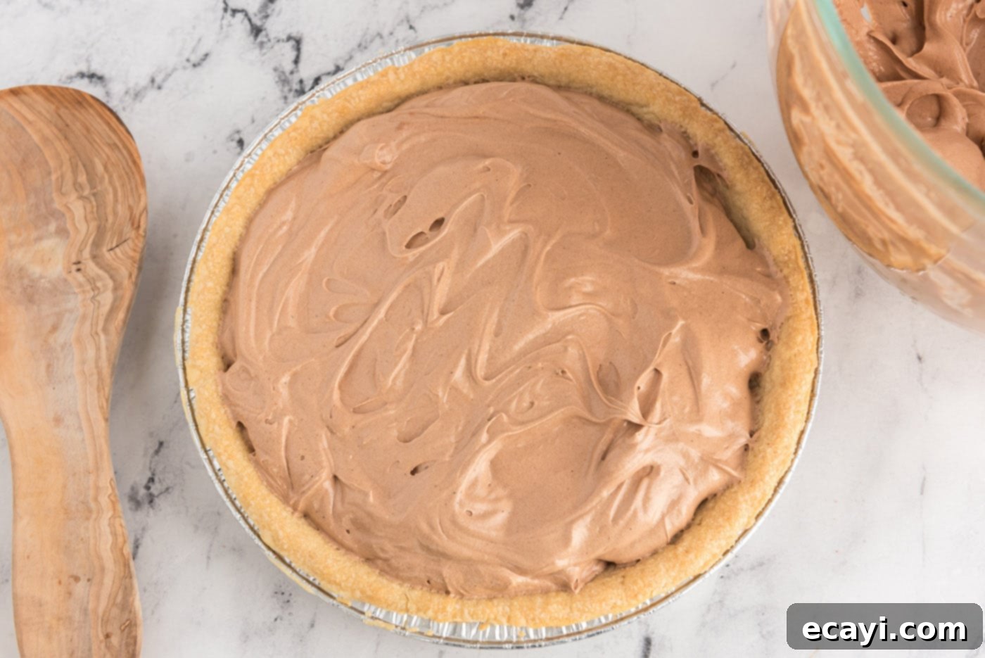 Silky Chocolate Dream 12 Overhead view of the smooth, dark chocolate French silk pie filling poured evenly into a cooled pie crust