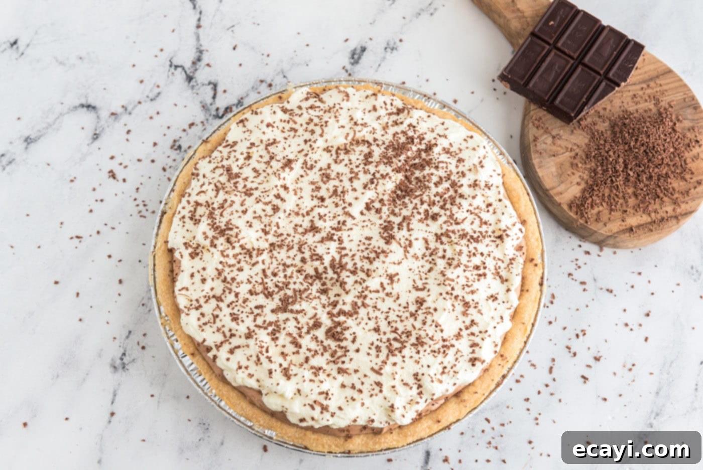 Silky Chocolate Dream 15 A whole French silk pie beautifully topped with mounds of whipped cream and garnished with elegant shaved chocolate curls, ready for serving