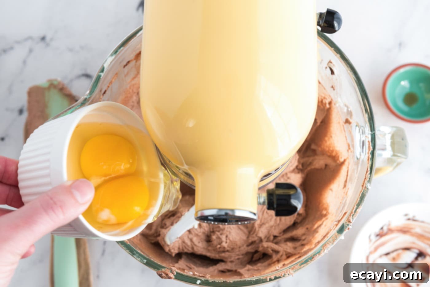 Silky Chocolate Dream 10 Adding eggs, two at a time, to the French silk pie mixture in a stand mixer