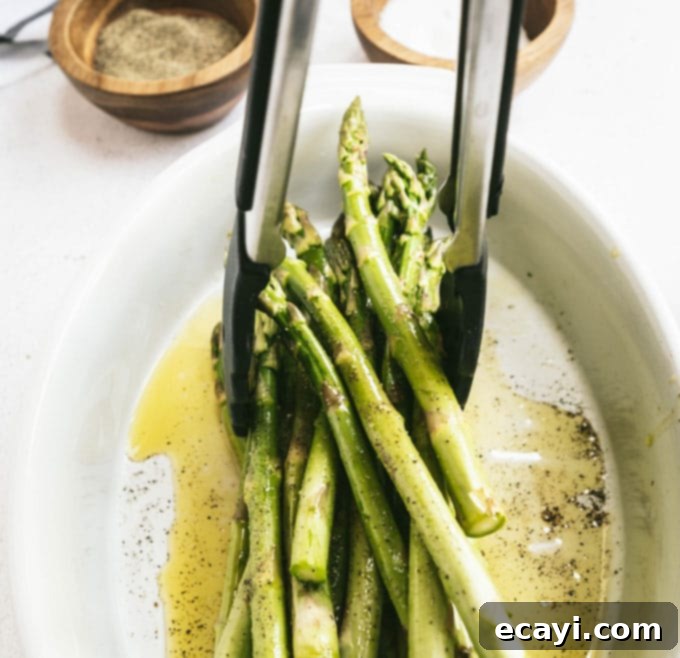 Smoky Green Spears 6 lifting asparagus with tongs