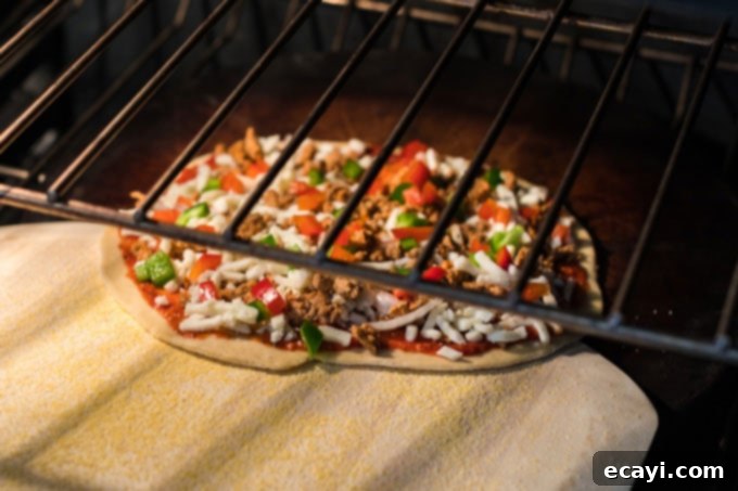 Whip Up Your Own Pizza Dough 13 sliding pizza off the peel into the hot oven
