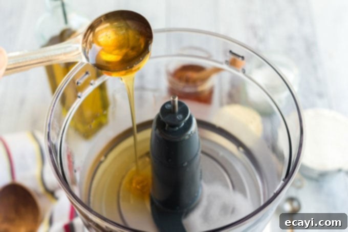 Whip Up Your Own Pizza Dough 5 adding honey to food processor to activate yeast