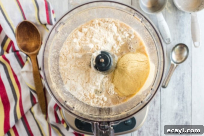 Whip Up Your Own Pizza Dough 6 pizza dough ingredients mixing in food processor