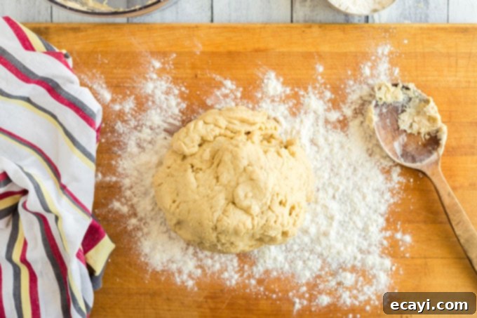 Whip Up Your Own Pizza Dough 8 pizza dough being kneaded on a floured wooden board