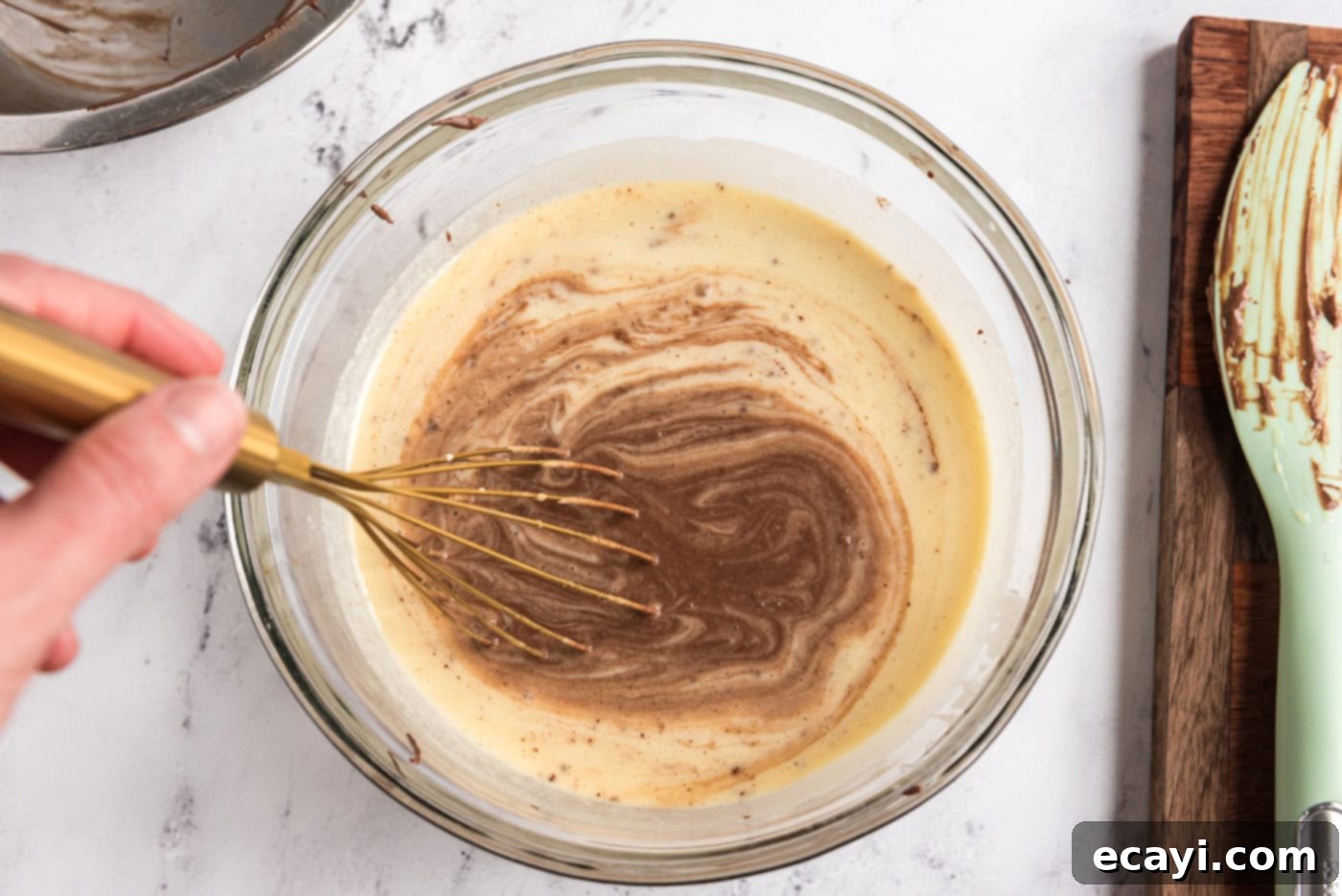 Decadent Homemade Chocolate Ice Cream 13 Whisking the cooled chocolate mixture into the cream and egg mixture in a large bowl to form the ice cream base